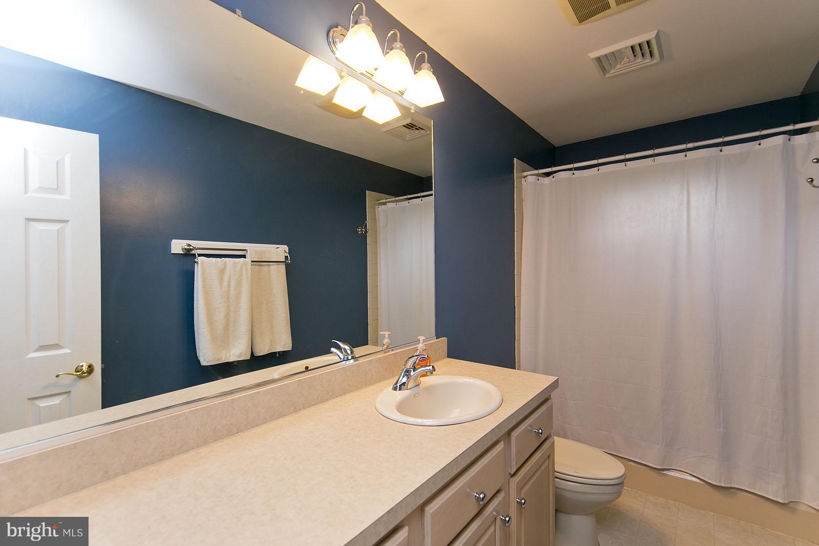 2360 Hunting Ridge Road Winchester, VA 22603 - Photo 16 of 30 a bathroom with a double vanity sink and a mirror