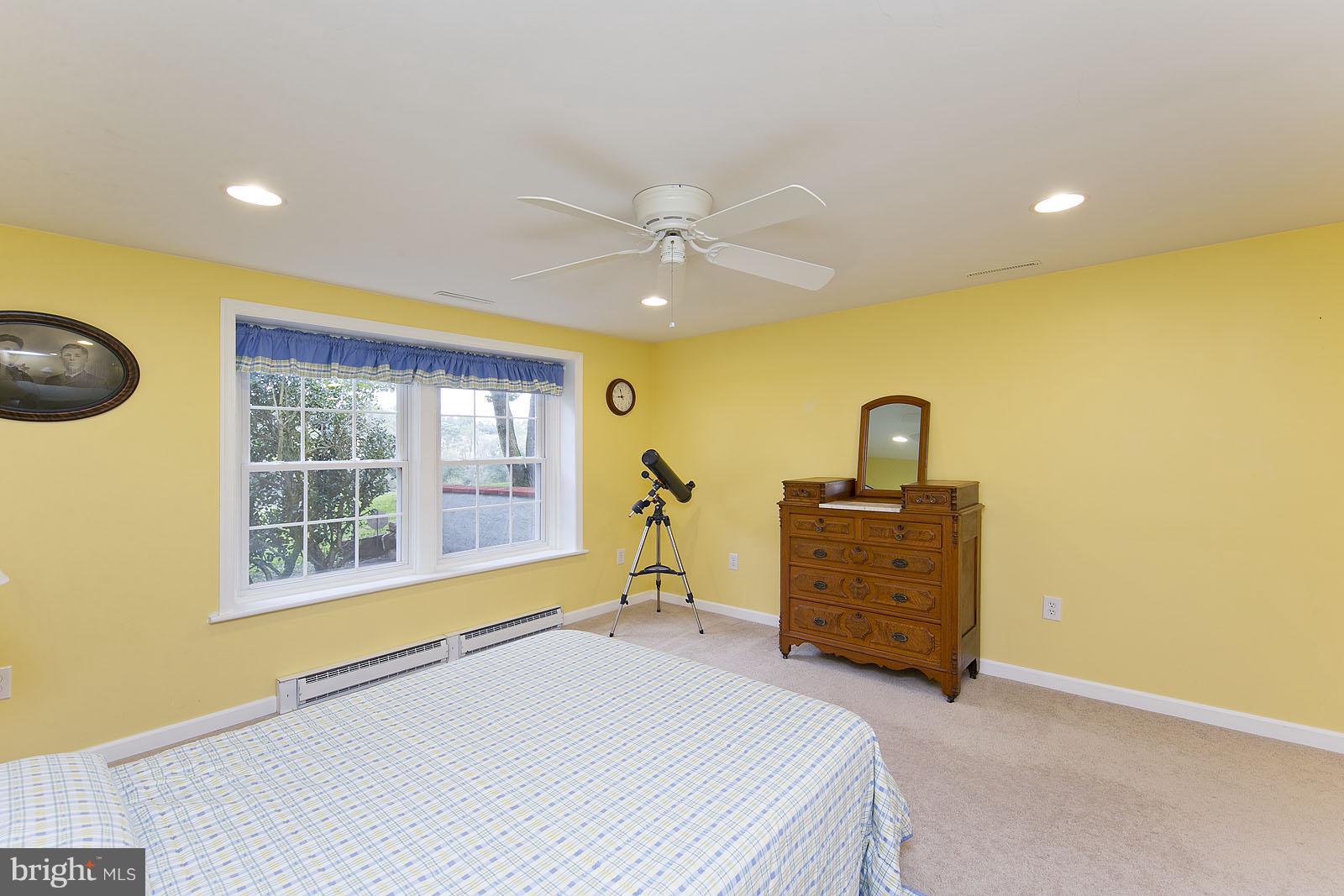 2360 Hunting Ridge Road Winchester, VA 22603 - Photo 19 of 30 a bedroom with a bed and a ceiling fan