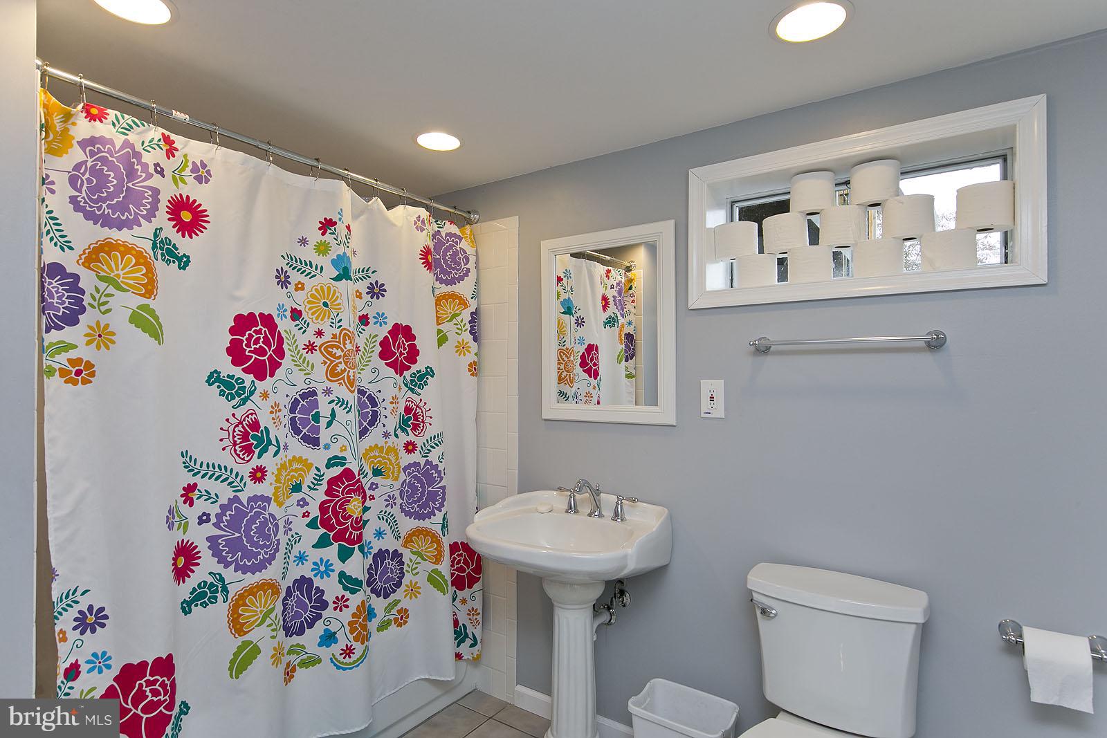 2360 Hunting Ridge Road Winchester, VA 22603 - Photo 20 of 30 a bathroom with a sink mirror and toilet