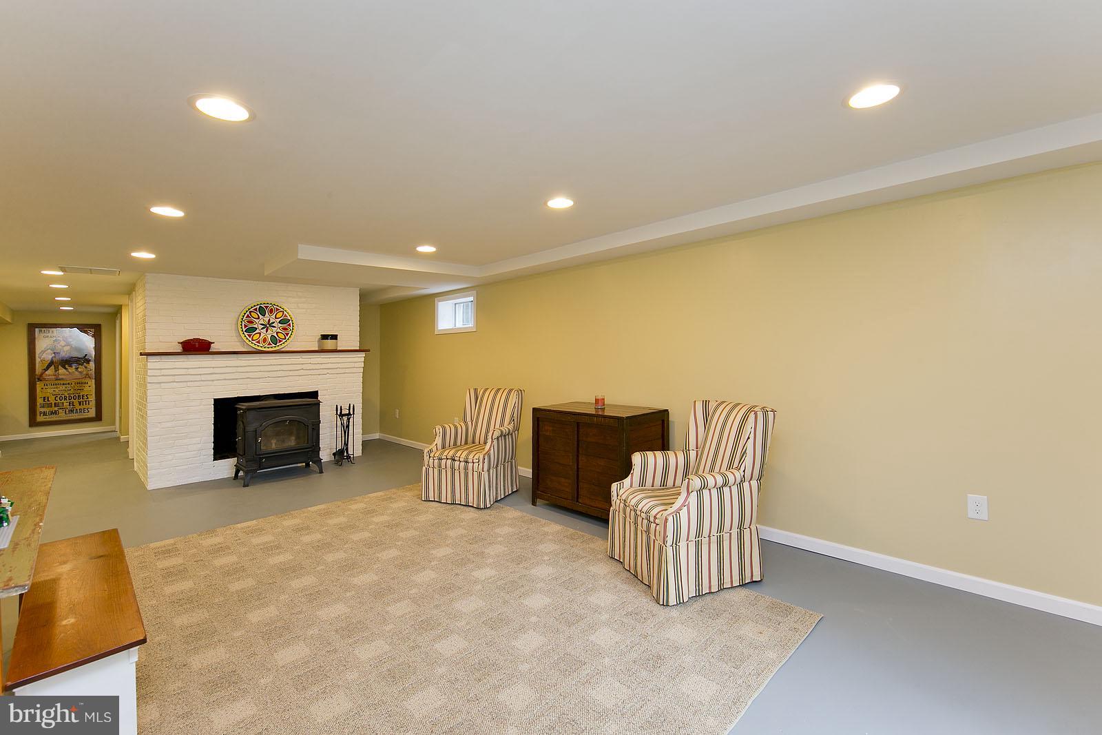 2360 Hunting Ridge Road Winchester, VA 22603 - Photo 22 of 30 a living room with furniture and a fireplace