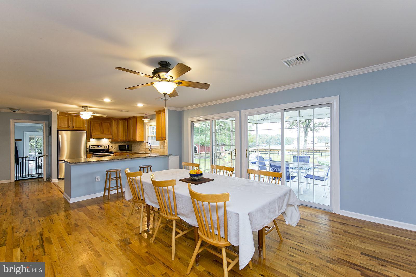 2360 Hunting Ridge Road Winchester, VA 22603 - Photo 8 of 30 a view of a dining room with furniture window and wooden floor
