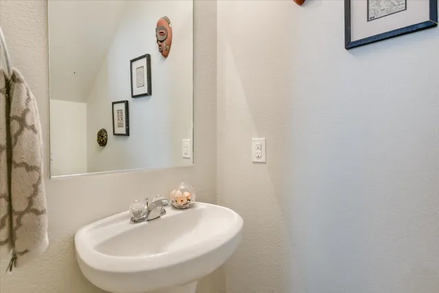 a bathroom with a sink and mirror
