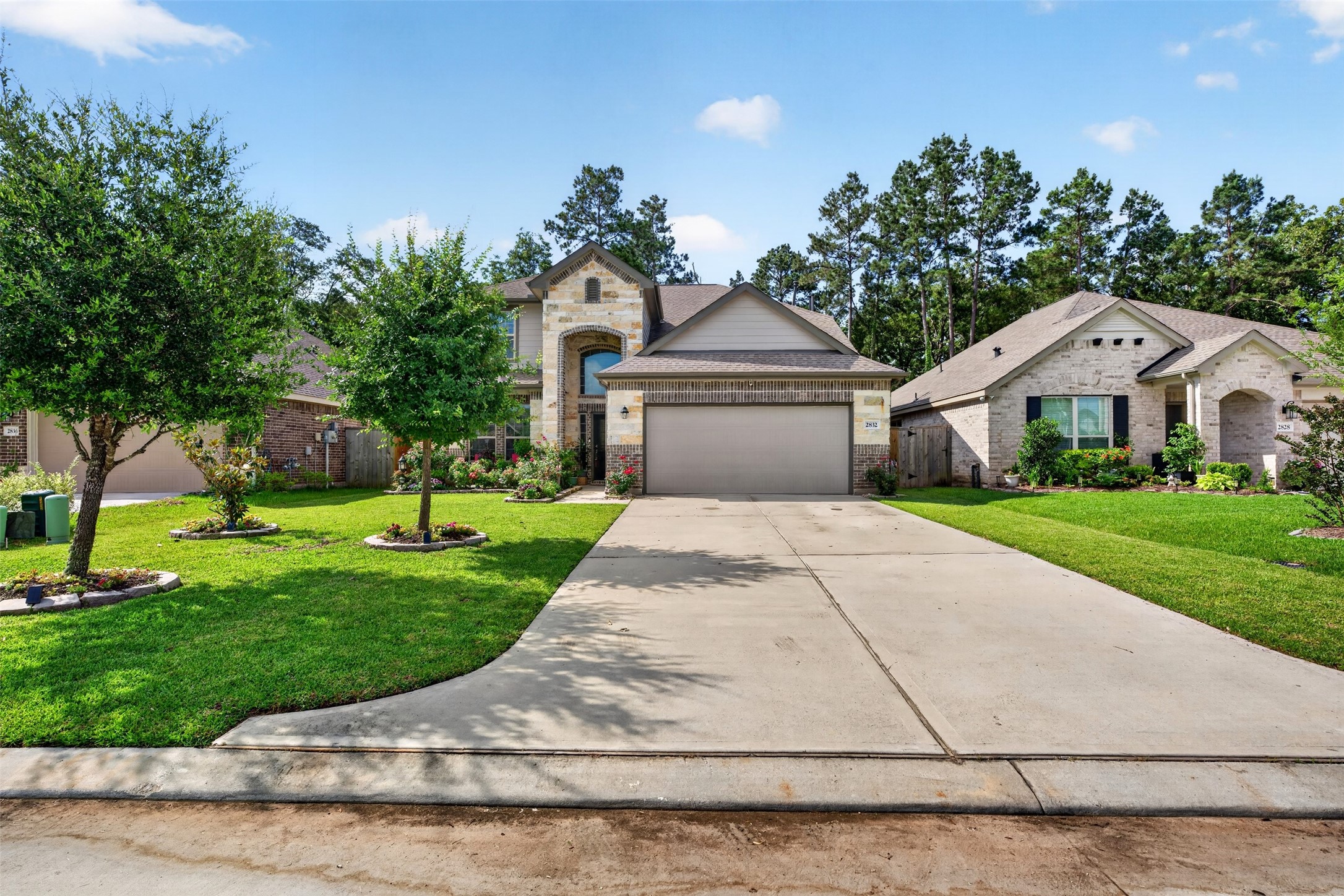 2832 Mistygate Court Conroe, TX 77301 - Photo 42 of 50 The front yard features beautiful shade trees and landscaping.