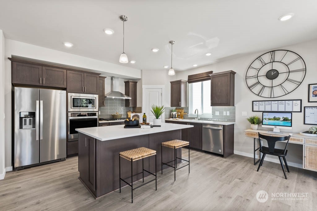 4414 228th Place South East, Unit MC5 Bothell, WA 98021 - Photo 11 of 33 a kitchen with sink cabinets and stainless steel appliances