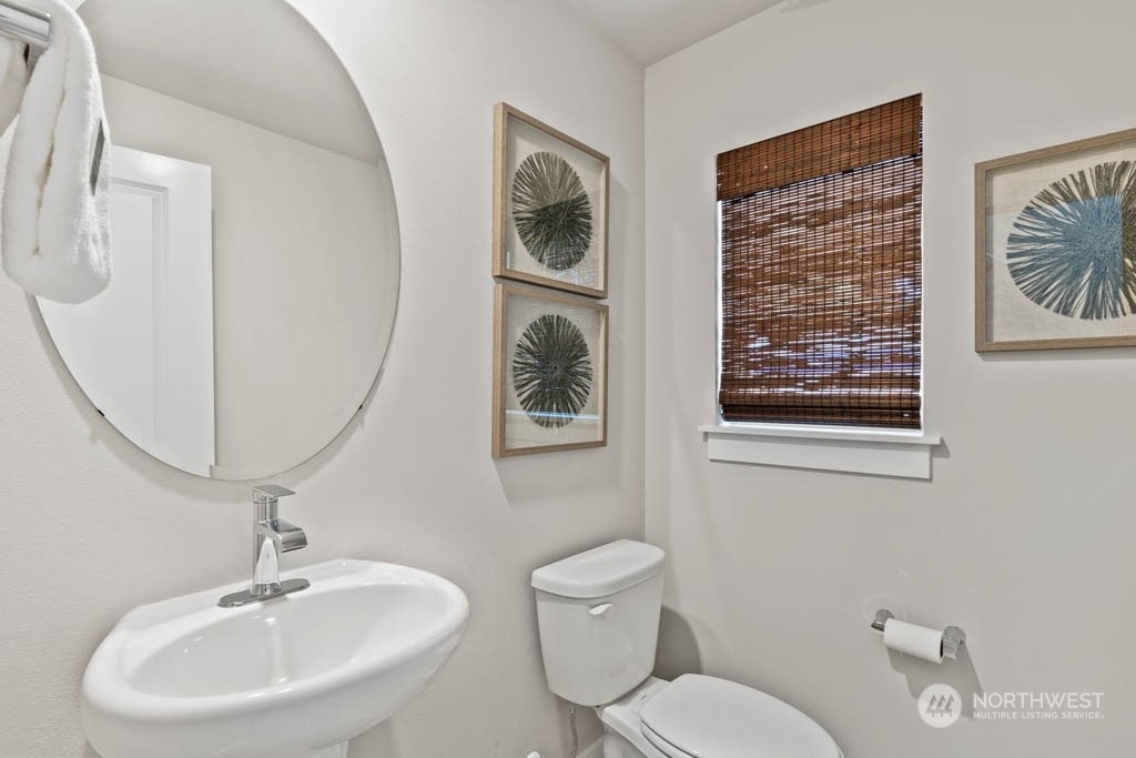 4414 228th Place South East, Unit MC5 Bothell, WA 98021 - Photo 19 of 33 a bathroom with a toilet a sink and mirror