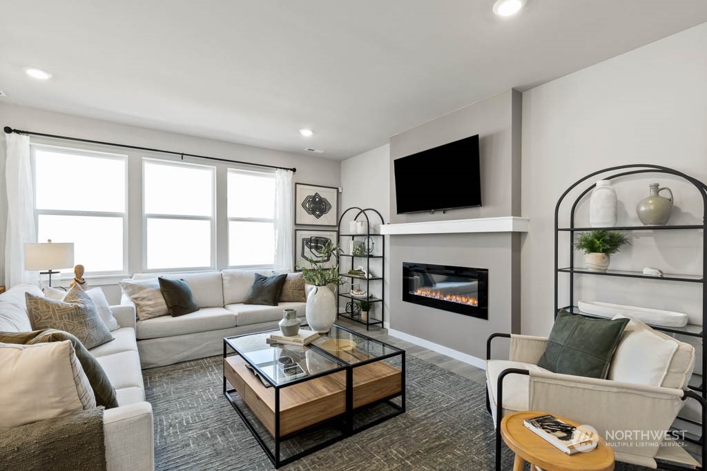4414 228th Place South East, Unit MC5 Bothell, WA 98021 - Photo 7 of 33 a living room with furniture fireplace and flat screen tv