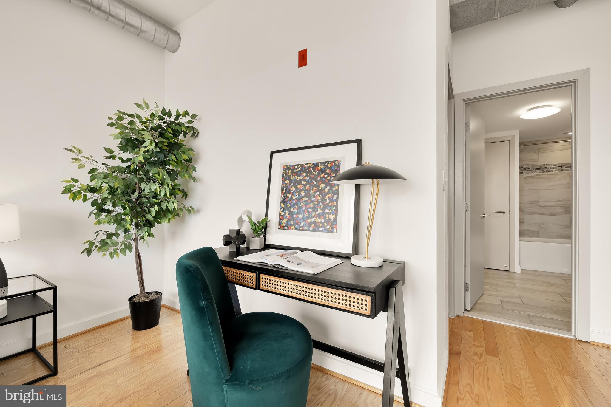 1390 V Street Northwest, Unit 413 Washington, DC 20009 - Photo 18 of 22 a dining room with furniture and a potted plant