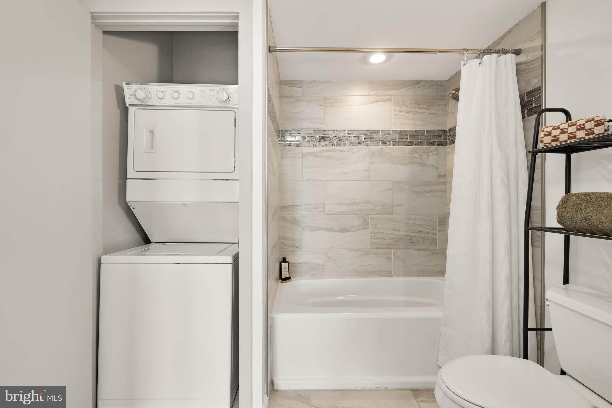 1390 V Street Northwest, Unit 413 Washington, DC 20009 - Photo 21 of 22 a bathroom with a shower a toilet and a sink