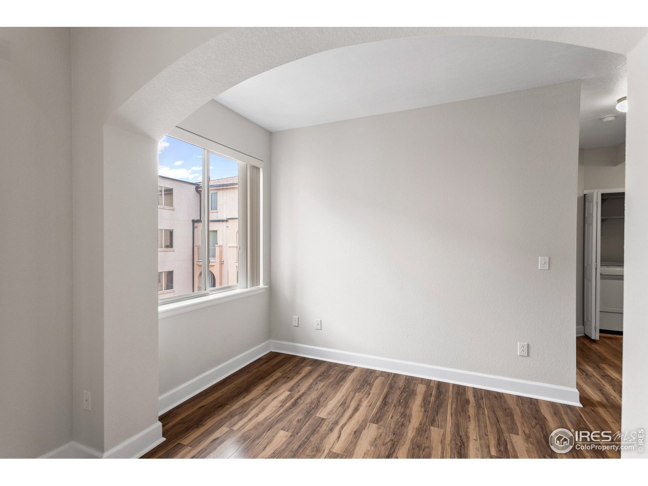 4500 Baseline Road, Unit 3302 Boulder, CO 80303 - Photo 19 of 22 a view of an empty room with wooden floor and a window