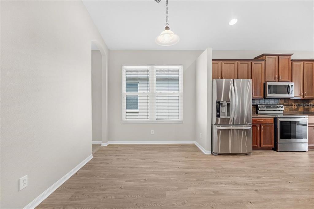 5124 Clover Mist Drive Apollo Beach, FL 33572 - Photo 14 of 52 a view of kitchen with sink microwave and refrigerator