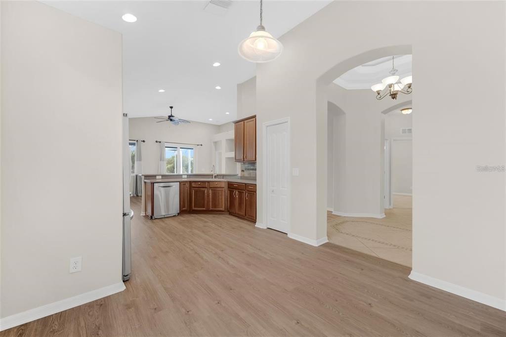 5124 Clover Mist Drive Apollo Beach, FL 33572 - Photo 16 of 52 a view of a kitchen with a sink cabinets and wooden floor