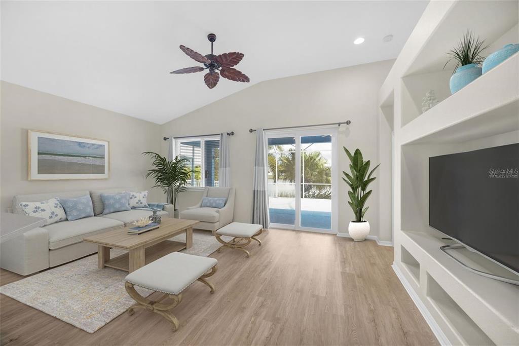 5124 Clover Mist Drive Apollo Beach, FL 33572 - Photo 18 of 52 a living room with furniture and a flat screen tv