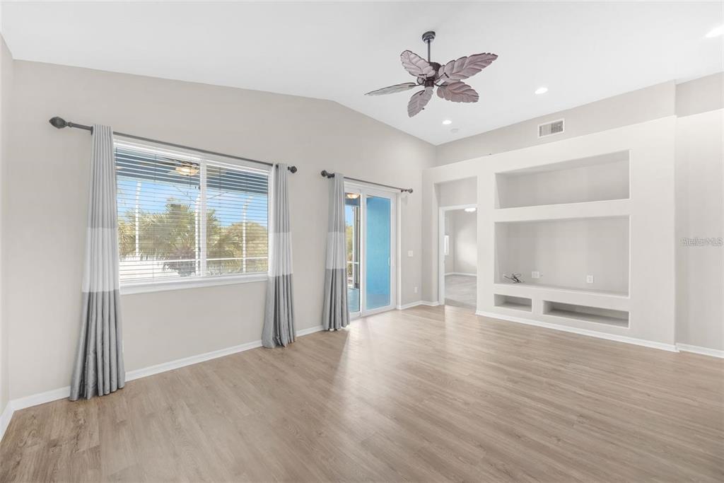 5124 Clover Mist Drive Apollo Beach, FL 33572 - Photo 20 of 52 a view of an empty room with a window and a ceiling fan