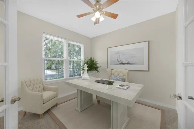a view of a dining room with furniture and window