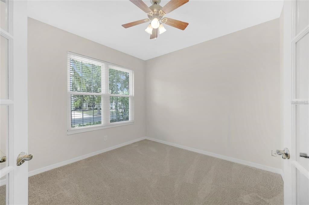 5124 Clover Mist Drive Apollo Beach, FL 33572 - Photo 24 of 52 an empty room with a window and a fan