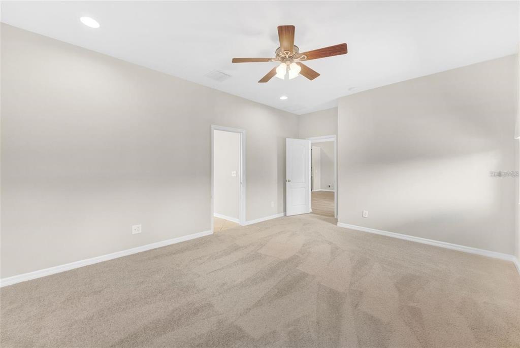 5124 Clover Mist Drive Apollo Beach, FL 33572 - Photo 31 of 52 an empty room with a window and a ceiling fan