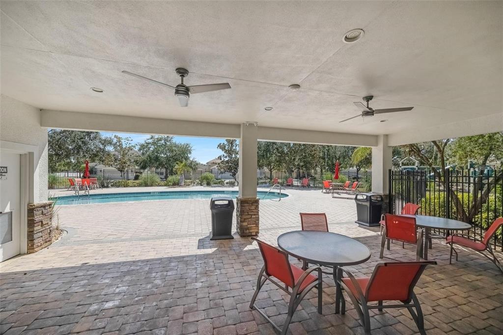 5124 Clover Mist Drive Apollo Beach, FL 33572 - Photo 43 of 52 a dining room with furniture a chandelier and wooden floor