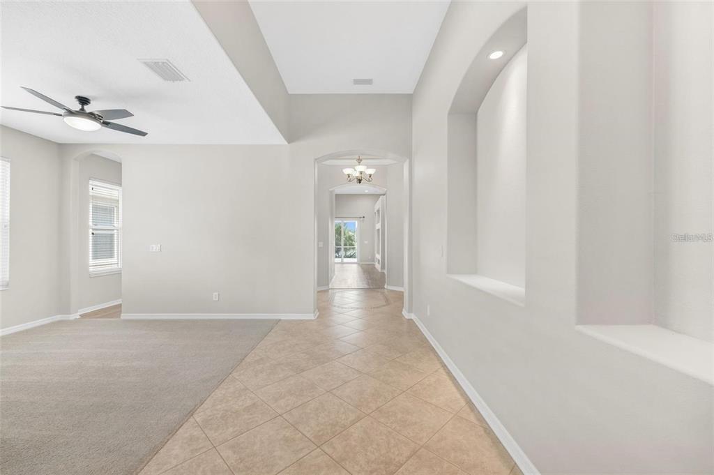 5124 Clover Mist Drive Apollo Beach, FL 33572 - Photo 7 of 52 wooden floor in a hall with an entryway