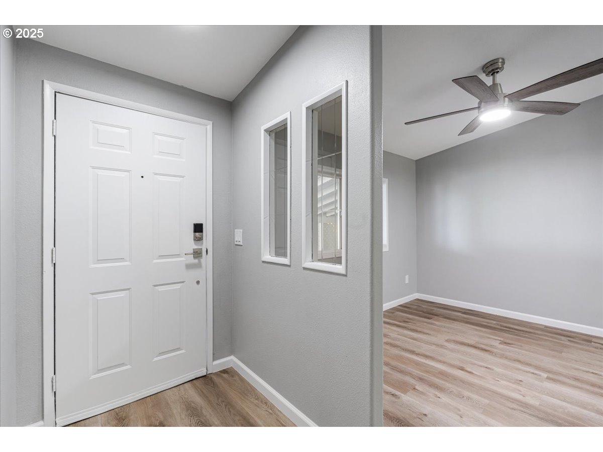 369 Gun Club Road, Unit 117 Woodland, WA 98674 - Photo 2 of 29 a view of an empty room and wooden floor