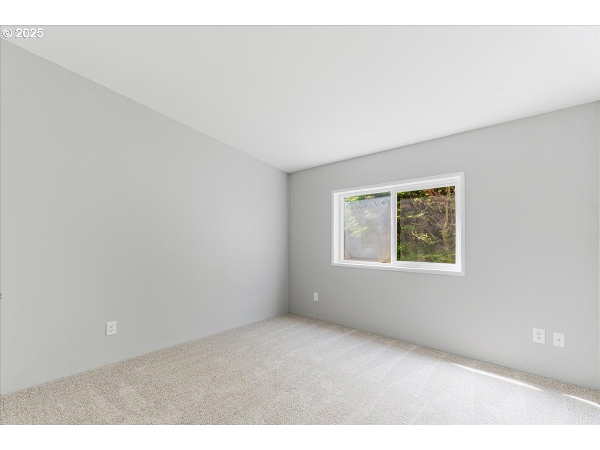 369 Gun Club Road, Unit 117 Woodland, WA 98674 - Photo 22 of 29 a view of an empty room with a window
