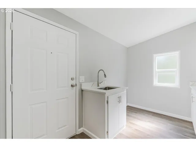 a view of a kitchen with a sink