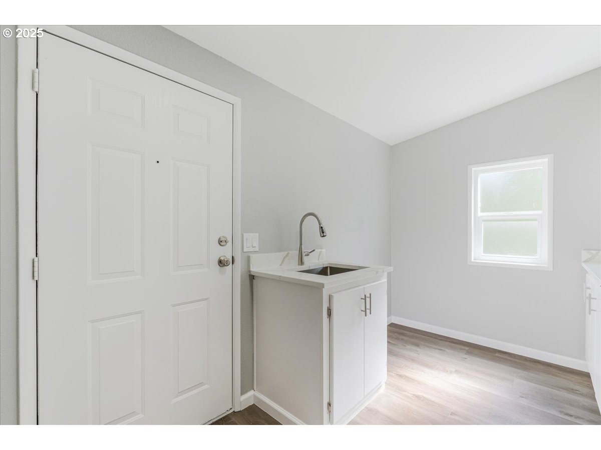 369 Gun Club Road, Unit 117 Woodland, WA 98674 - Photo 24 of 29 a view of a kitchen with a sink