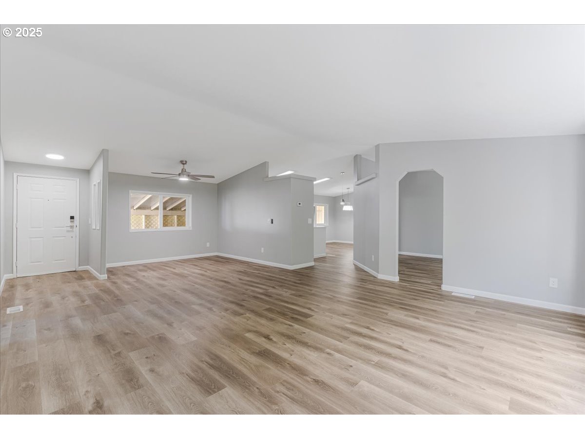 369 Gun Club Road, Unit 117 Woodland, WA 98674 - Photo 3 of 29 a view of empty room with wooden floor