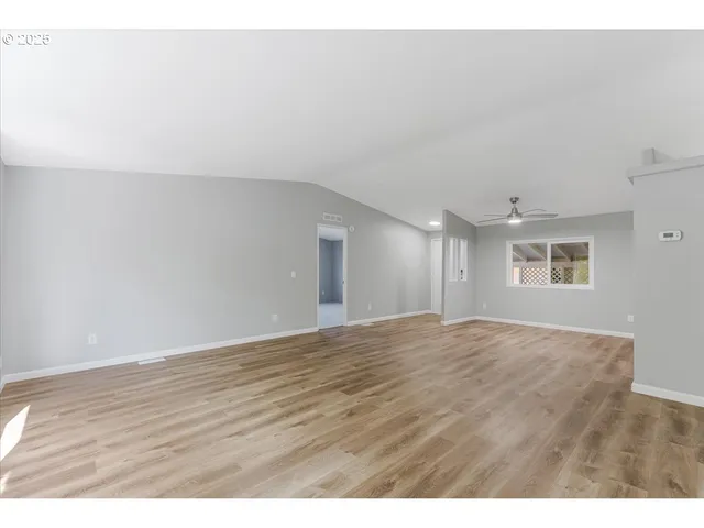a view of an empty room and window