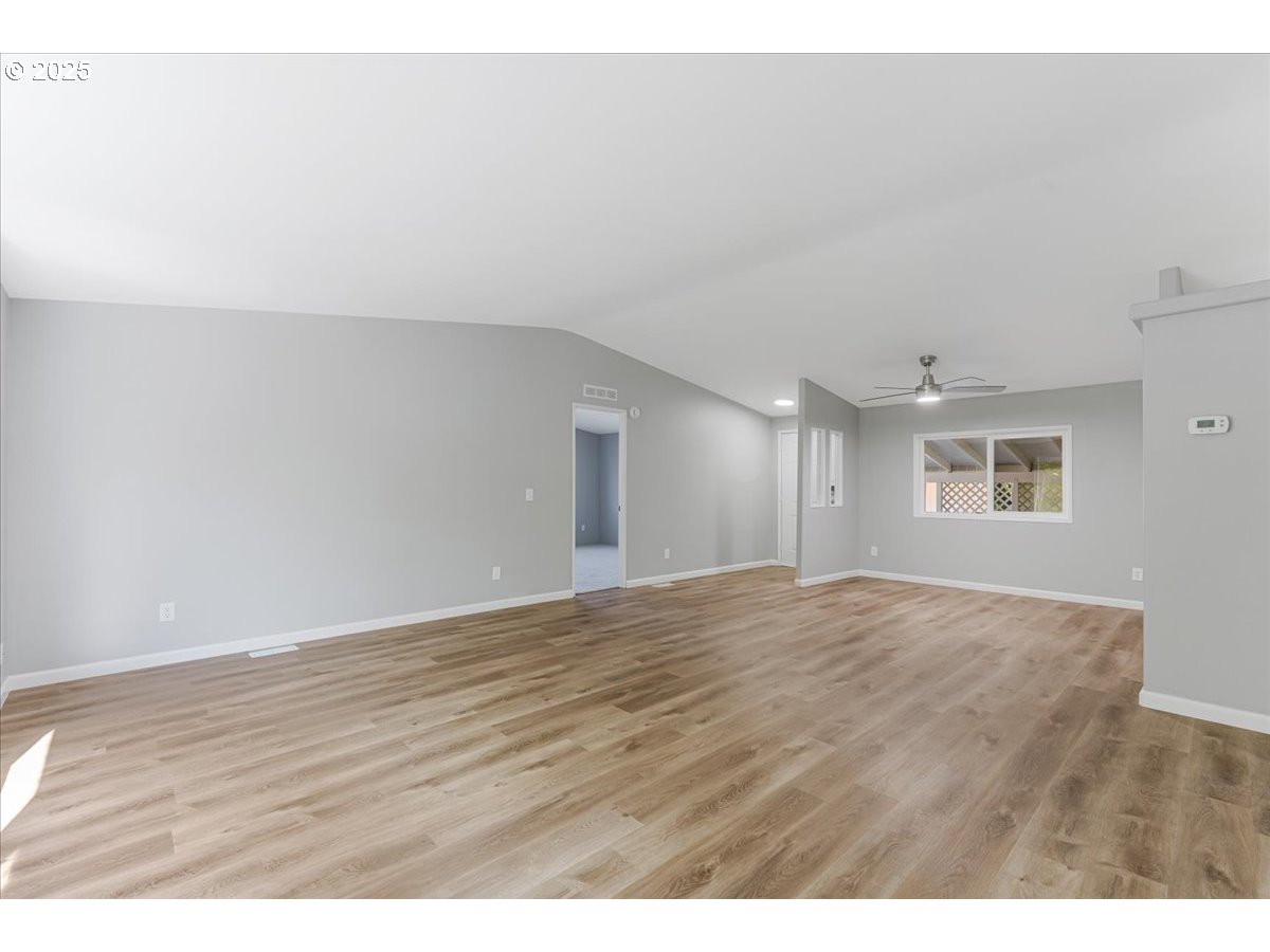 369 Gun Club Road, Unit 117 Woodland, WA 98674 - Photo 6 of 29 a view of an empty room and window