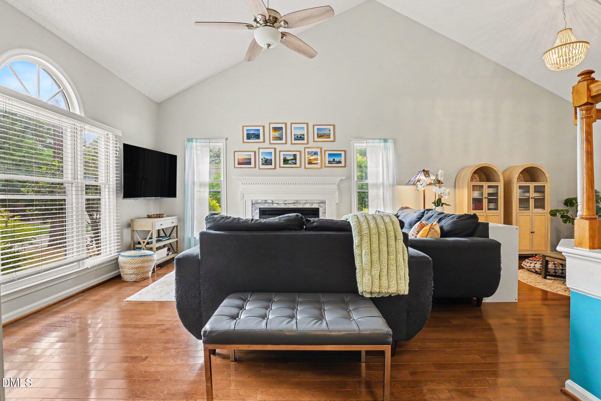 5468 Ingate Way Raleigh, NC 27613 - Photo 12 of 24 a living room with furniture and a flat screen tv