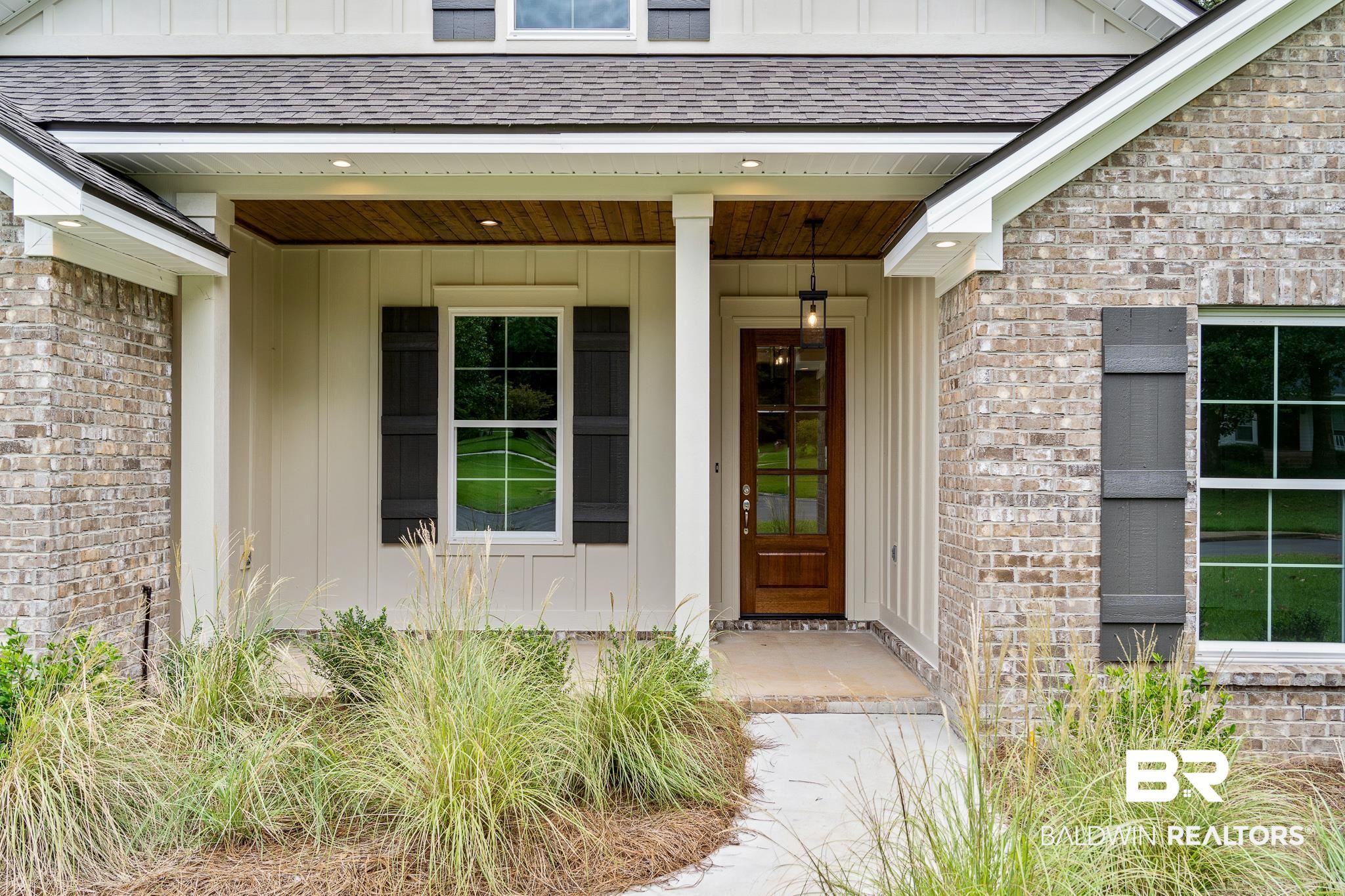 29 Signal Hill Road Daphne, AL 36527 - Photo 4 of 36 Entrance to property featuring covered porch