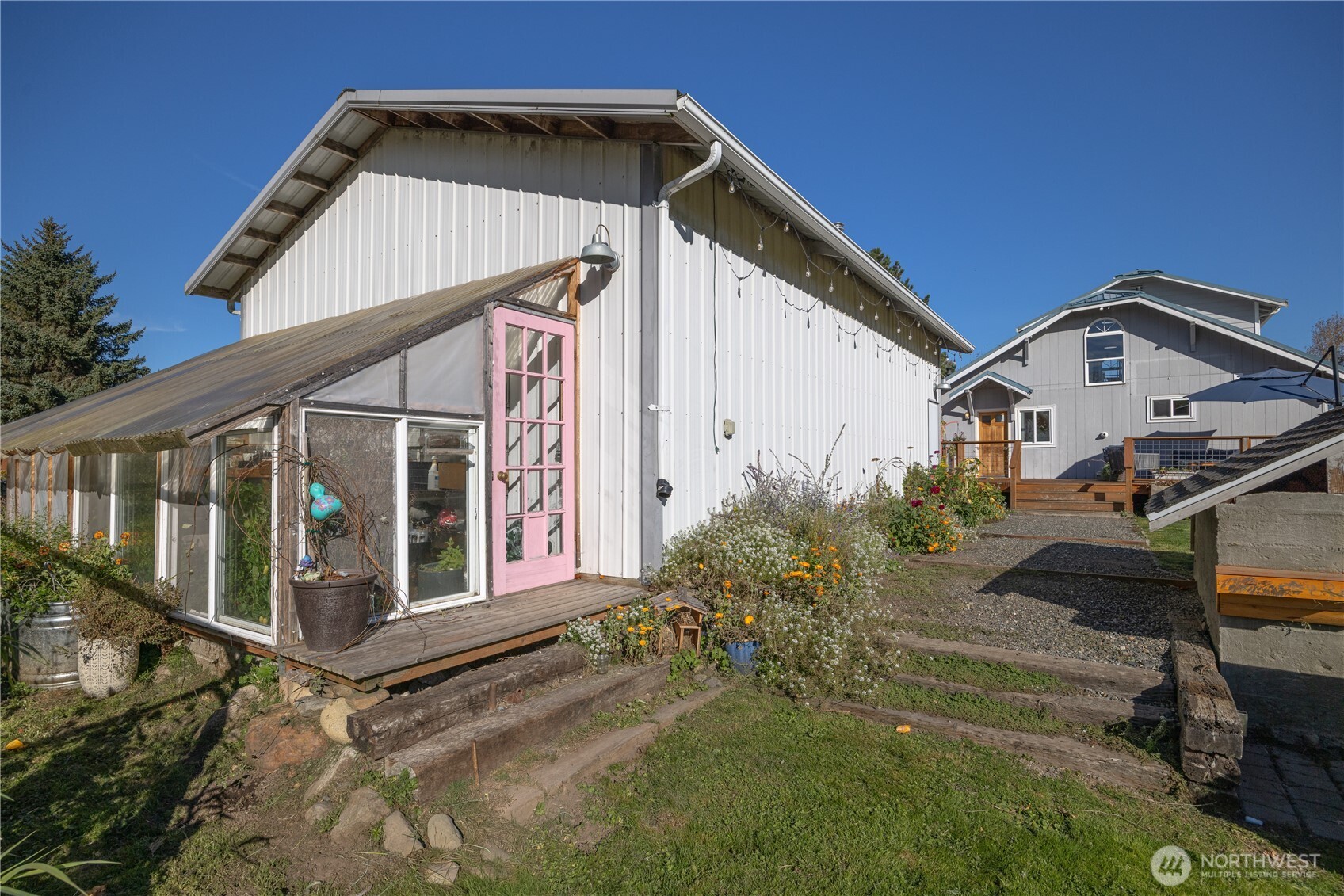 3895 Bancroft Road Bellingham, WA 98225 - Photo 25 of 40 a view of a small house with wooden fence