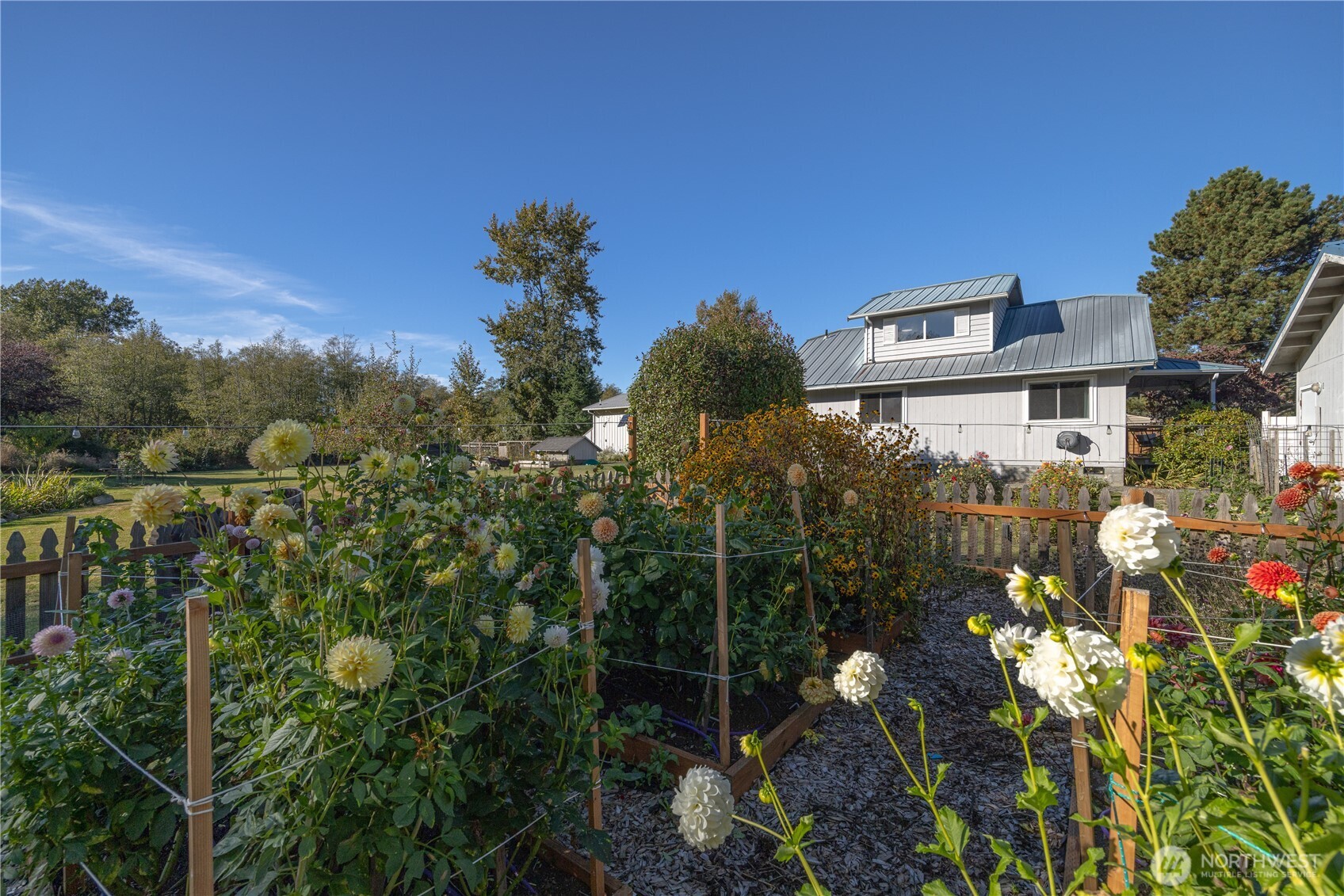 3895 Bancroft Road Bellingham, WA 98225 - Photo 29 of 40 a view of a house with a yard