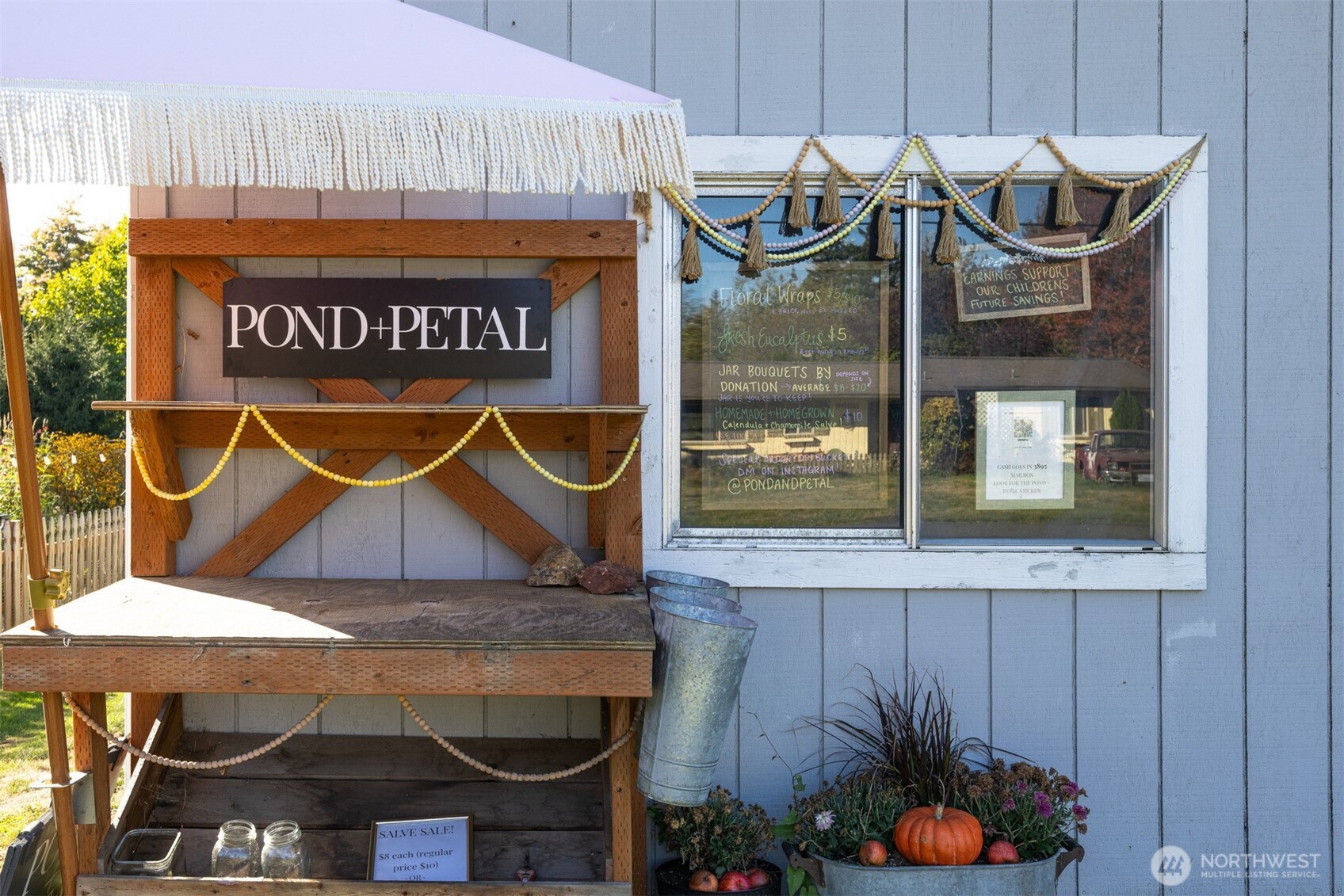 3895 Bancroft Road Bellingham, WA 98225 - Photo 32 of 40 a table with a vase of flowers on it