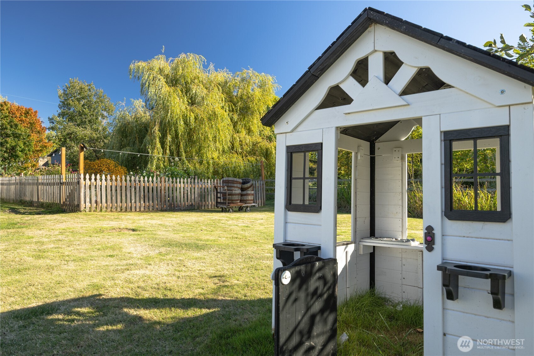 3895 Bancroft Road Bellingham, WA 98225 - Photo 33 of 40 a view of a house with backyard and deck