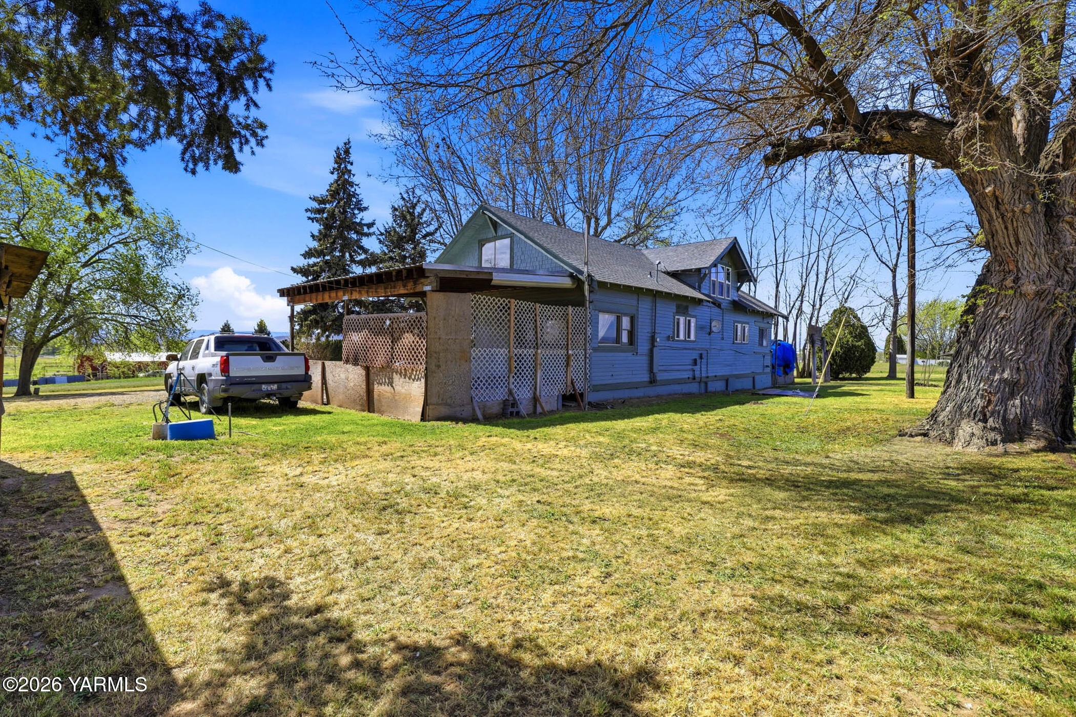 721 Blaine Road Granger, WA 98932 - Photo 32 of 45 a view of a house with a yard