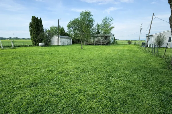 a view of a house with a big yard