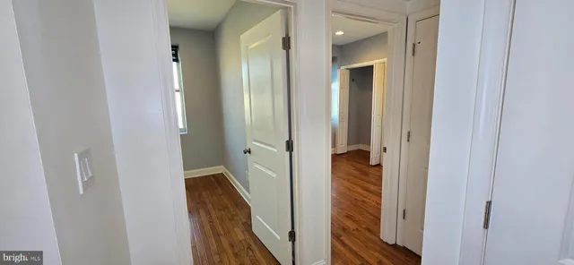 a view of a hallway with the wooden floor