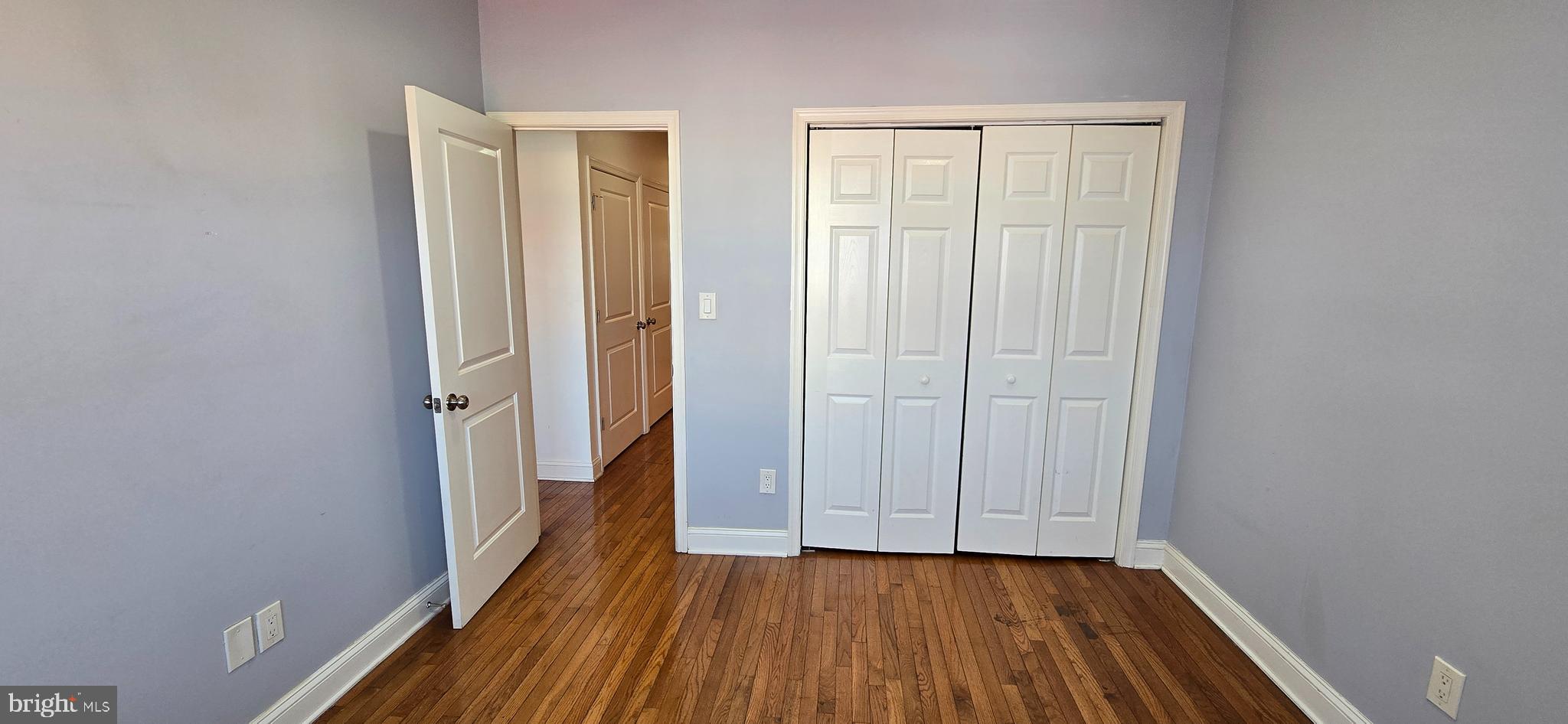 1835 Benning Road Northeast, Unit 1 Washington, DC 20002 - Photo 6 of 12 a view of a hallway with wooden floor