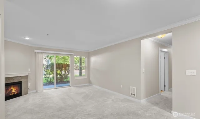 an empty room with furniture and a fireplace