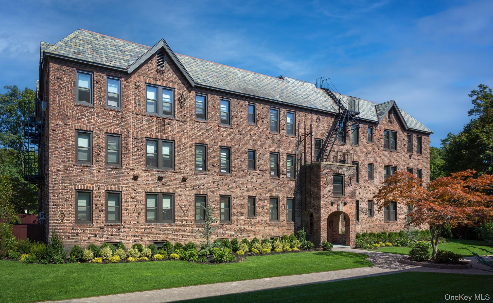 205 Steven Place, Unit B2 Woodmere, NY 11598 - Photo 1 of 1 front view of a house with a yard