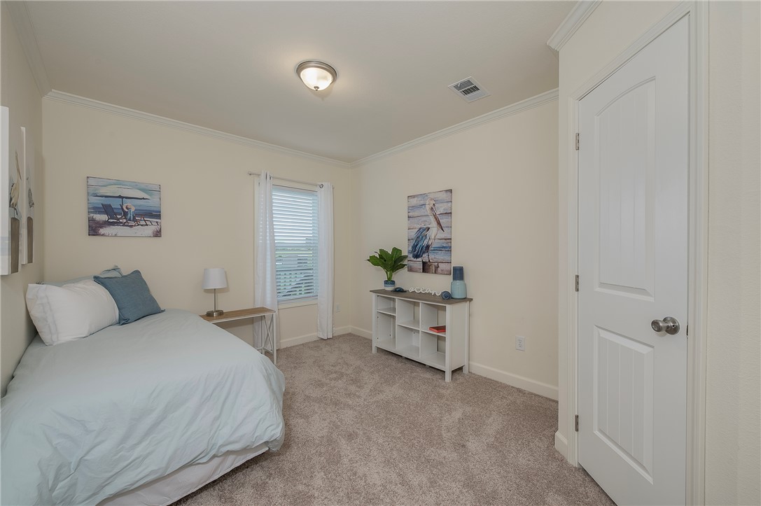 10976 Whiterock Road Bremond, TX 76629 - Photo 22 of 42 a bedroom with a bed and a table in it
