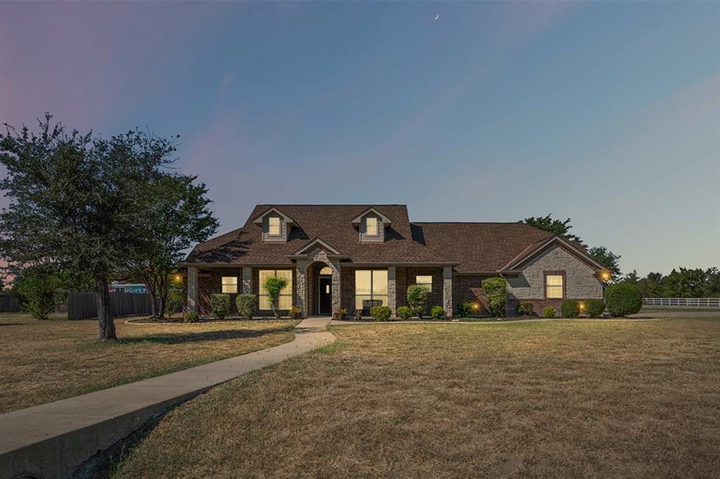 6009 Feather Wind Way Fort Worth, TX 76135 - Photo 1 of 19 a front view of a house with a yard