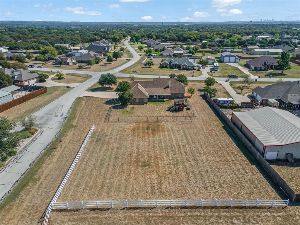 6009 Feather Wind Way Fort Worth, TX 76135 - Photo 3 of 19 an aerial view of a house with a yard