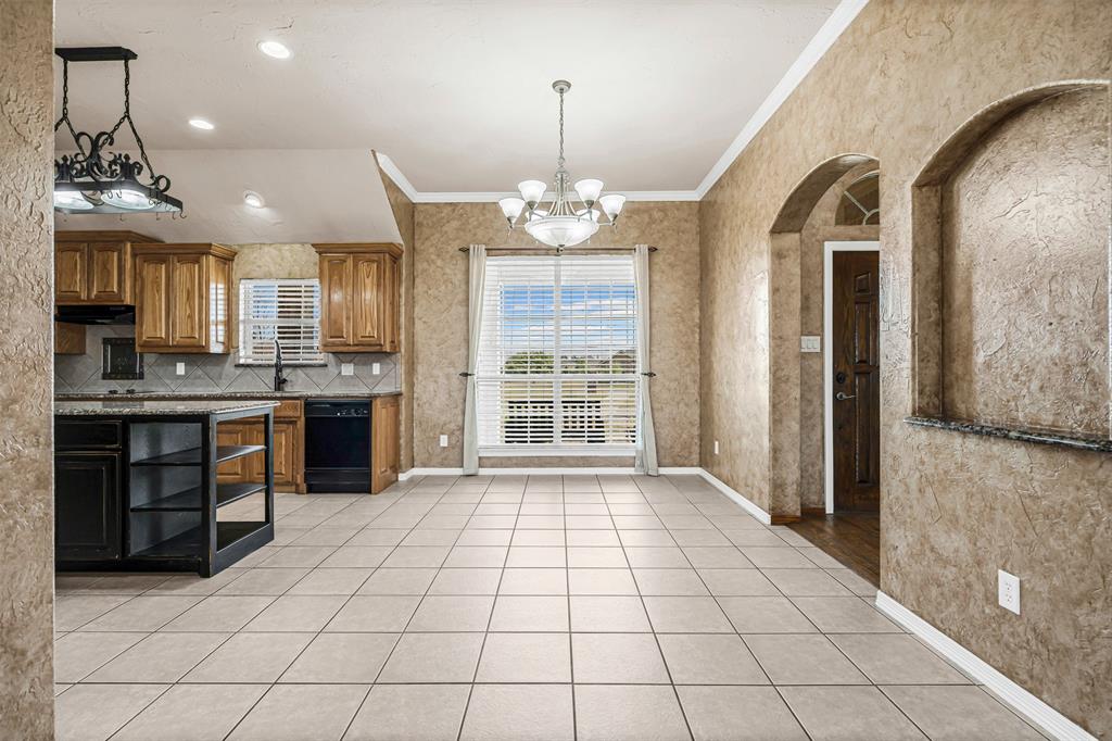 6009 Feather Wind Way Fort Worth, TX 76135 - Photo 7 of 19 a view of a kitchen with a sink and a window