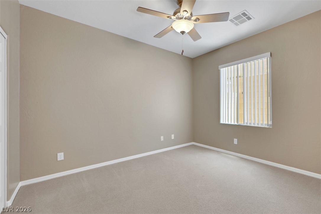 2501 Bechamel Place Henderson, NV 89044 - Photo 16 of 50 A well-proportioned bedroom with a window offering ample light, ready for your personal touch.