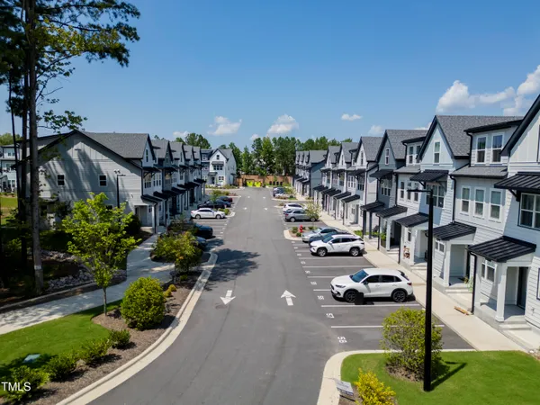 a view of multiple houses with yard