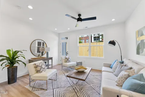 a living room with furniture and a window