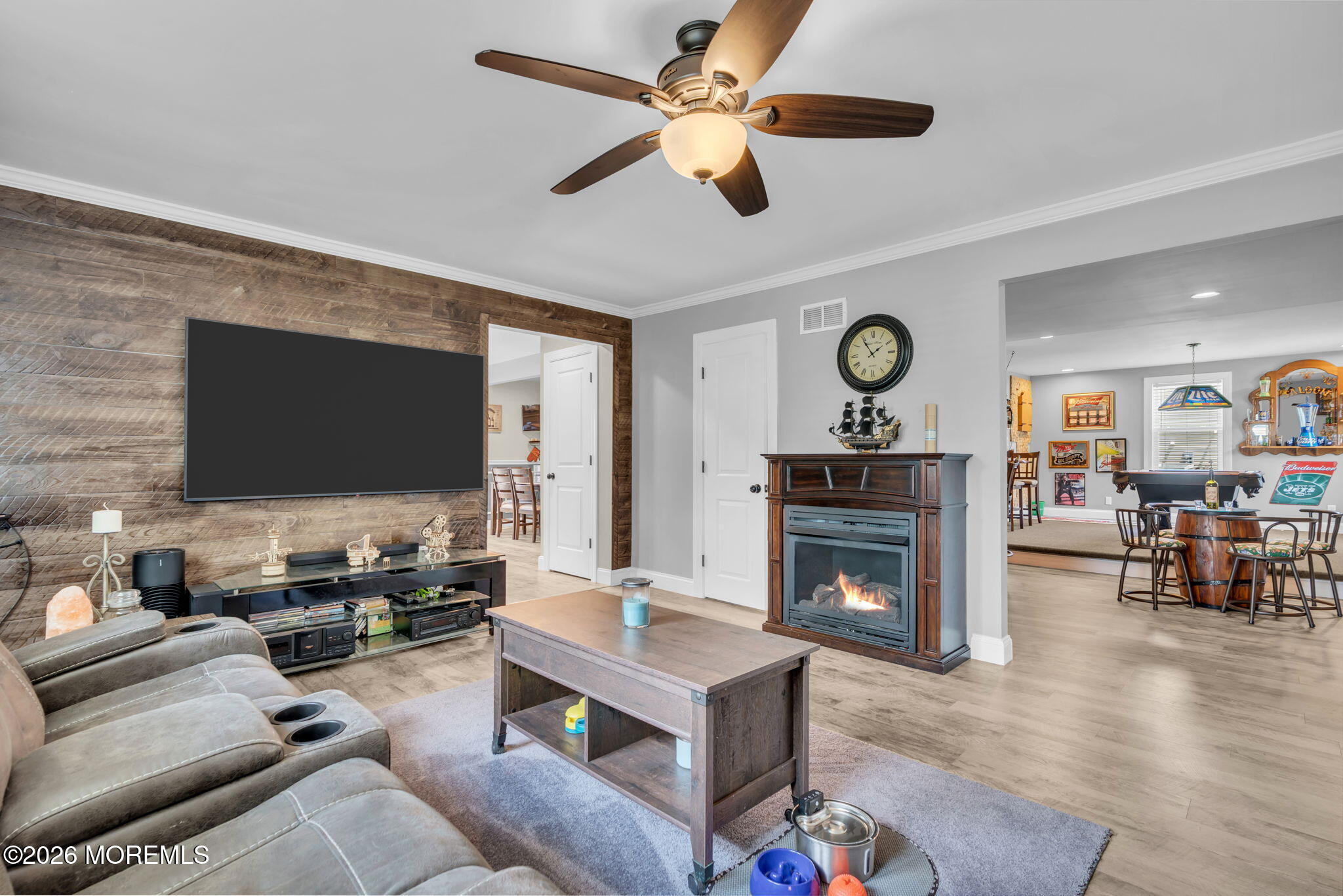 181 Locust Avenue Howell, NJ 07731 - Photo 14 of 66 a living room with furniture flat screen tv and a fireplace