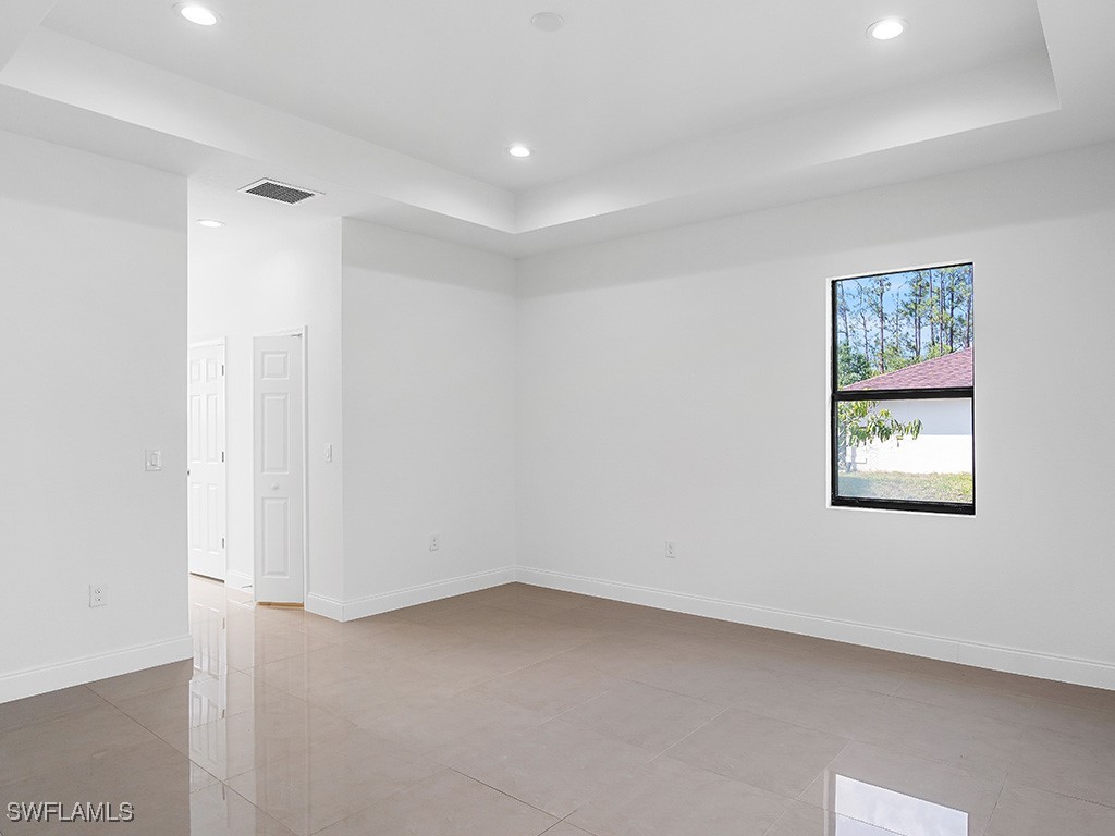 902 Williams Avenue Lehigh Acres, FL 33972 - Photo 14 of 30 a view of an empty room with a window